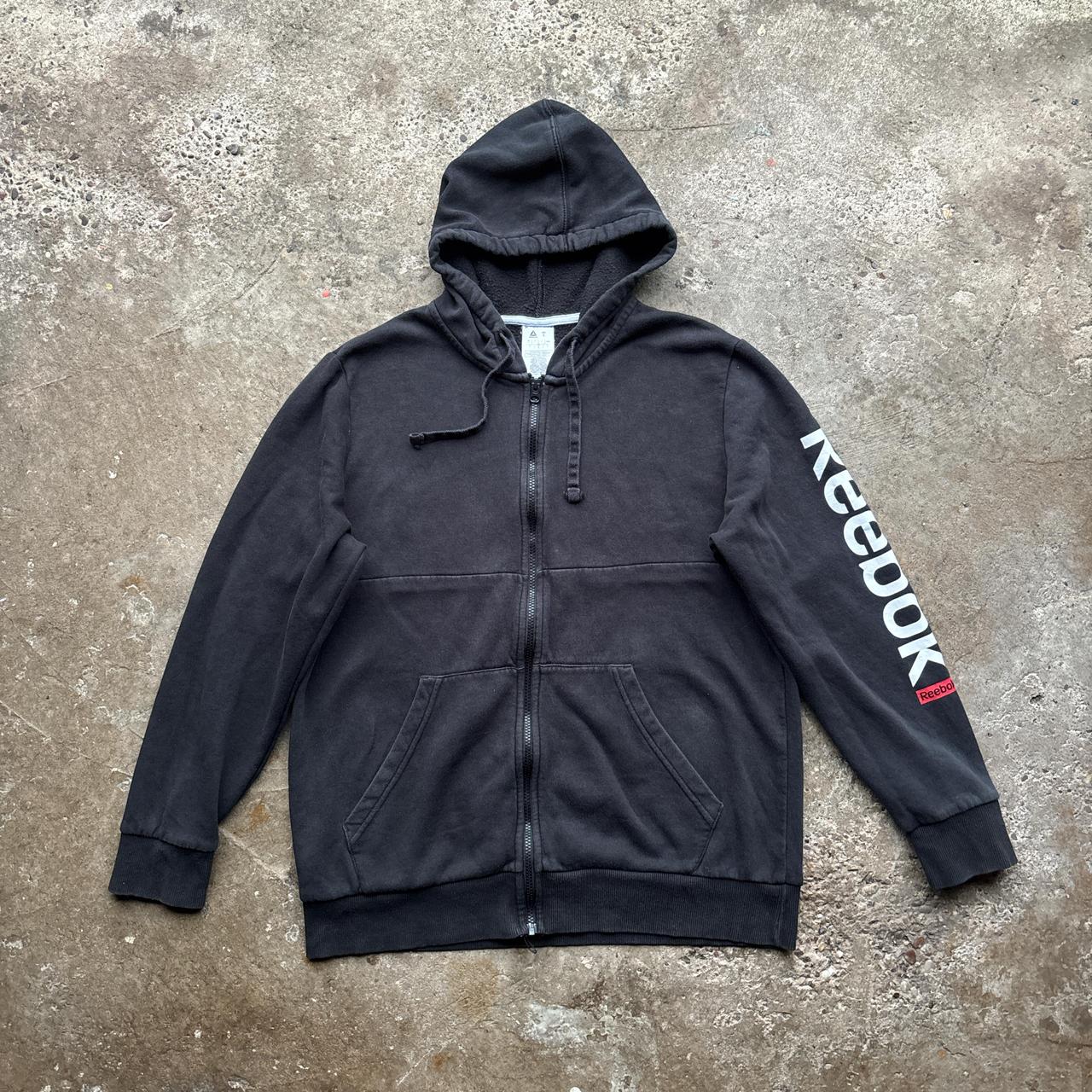 Black Reebok zip-up hoody with spell out logo