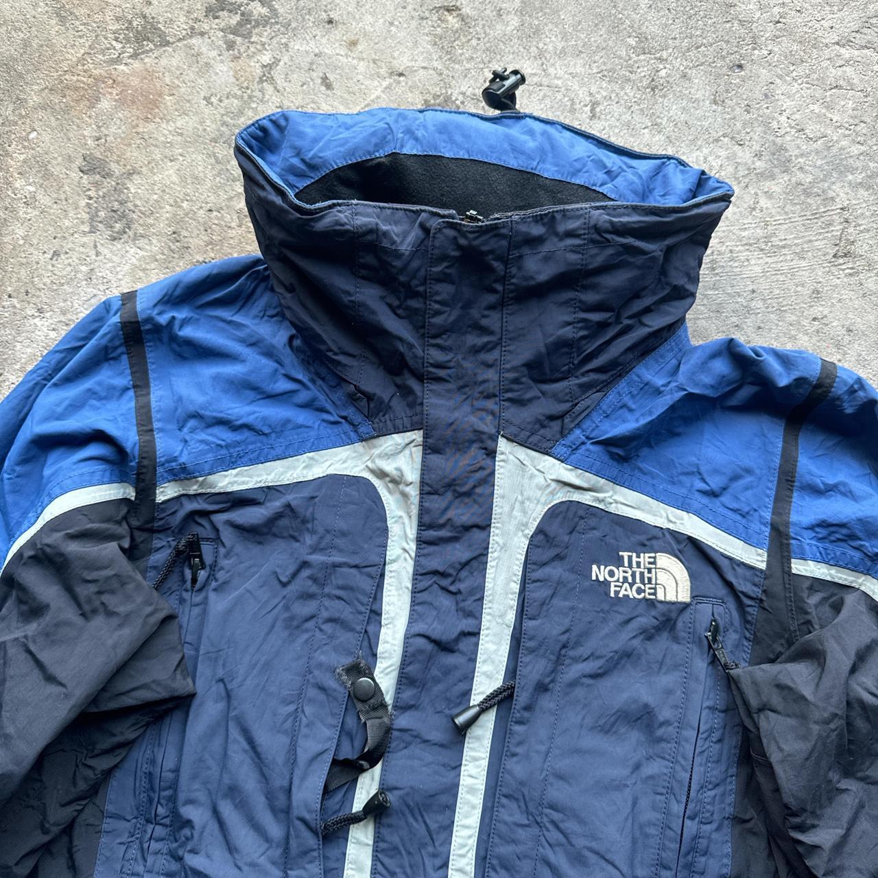 Navy, blue and black The North Face winter jacket