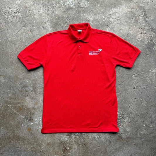 Red polo shirt with removal company embroidered design