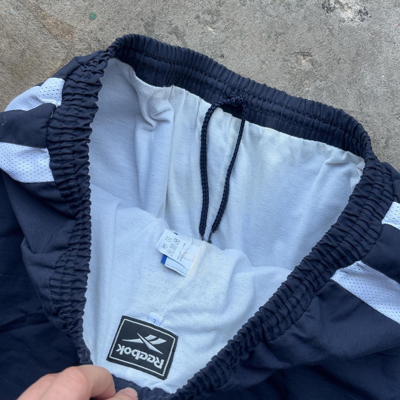 Vintage Navy Reebok tracksuit bottoms with embroidered logo