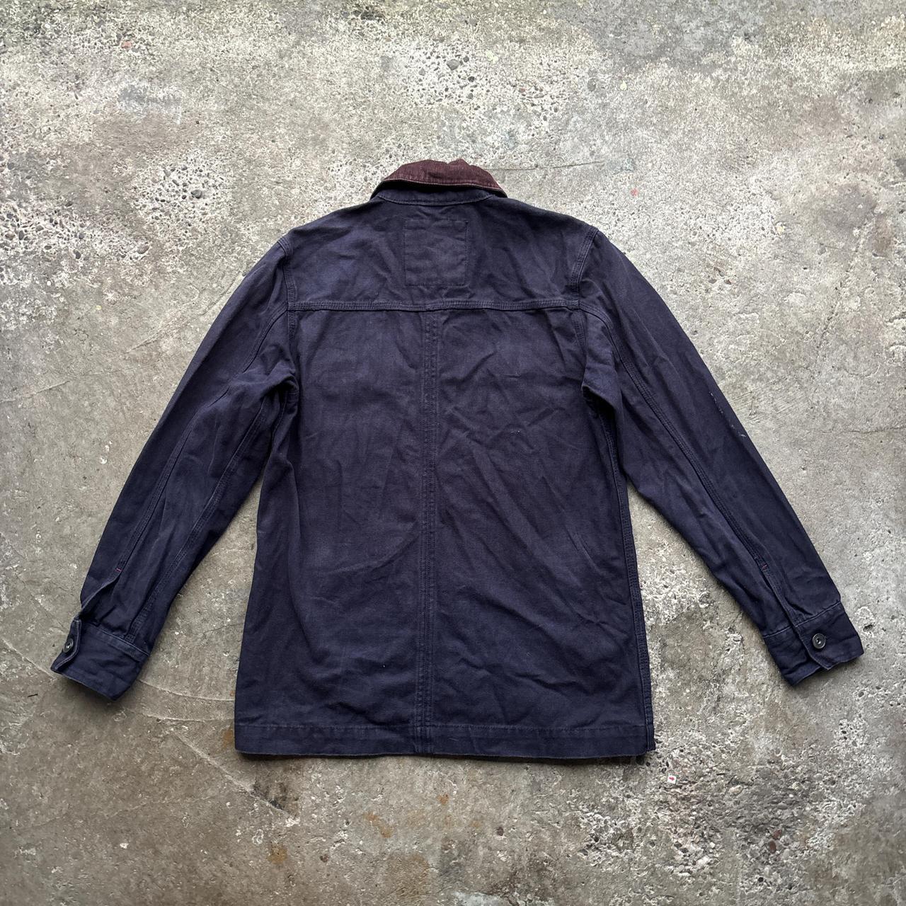 Navy workwear jacket with burgundy collar