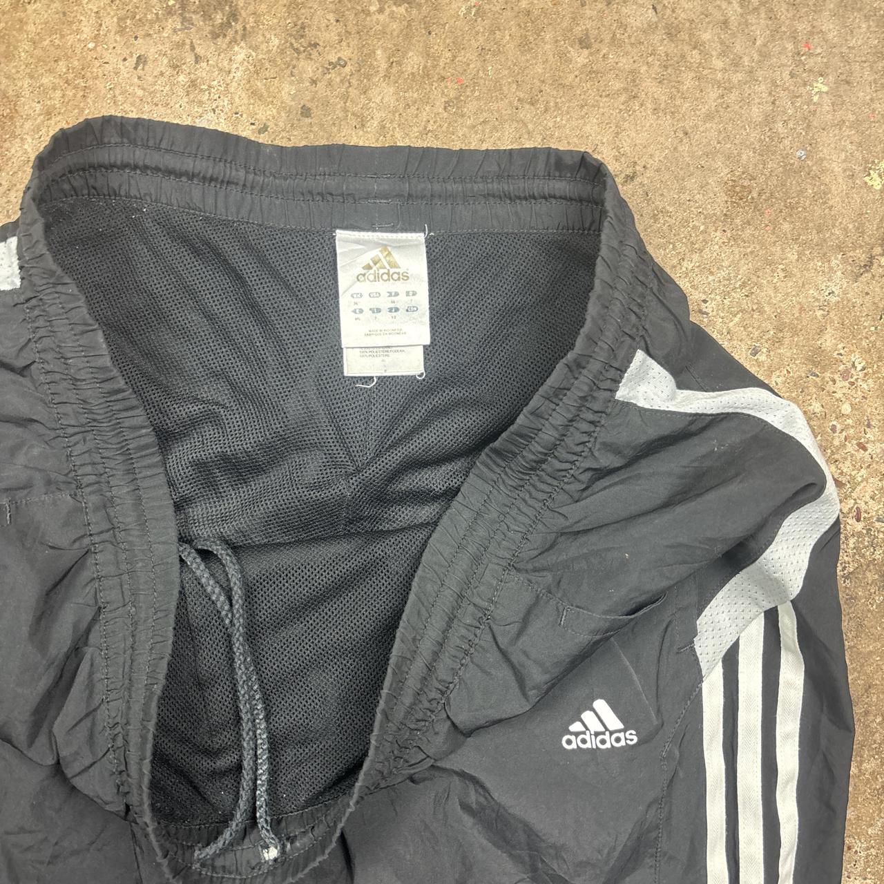 Black Adidas track pants