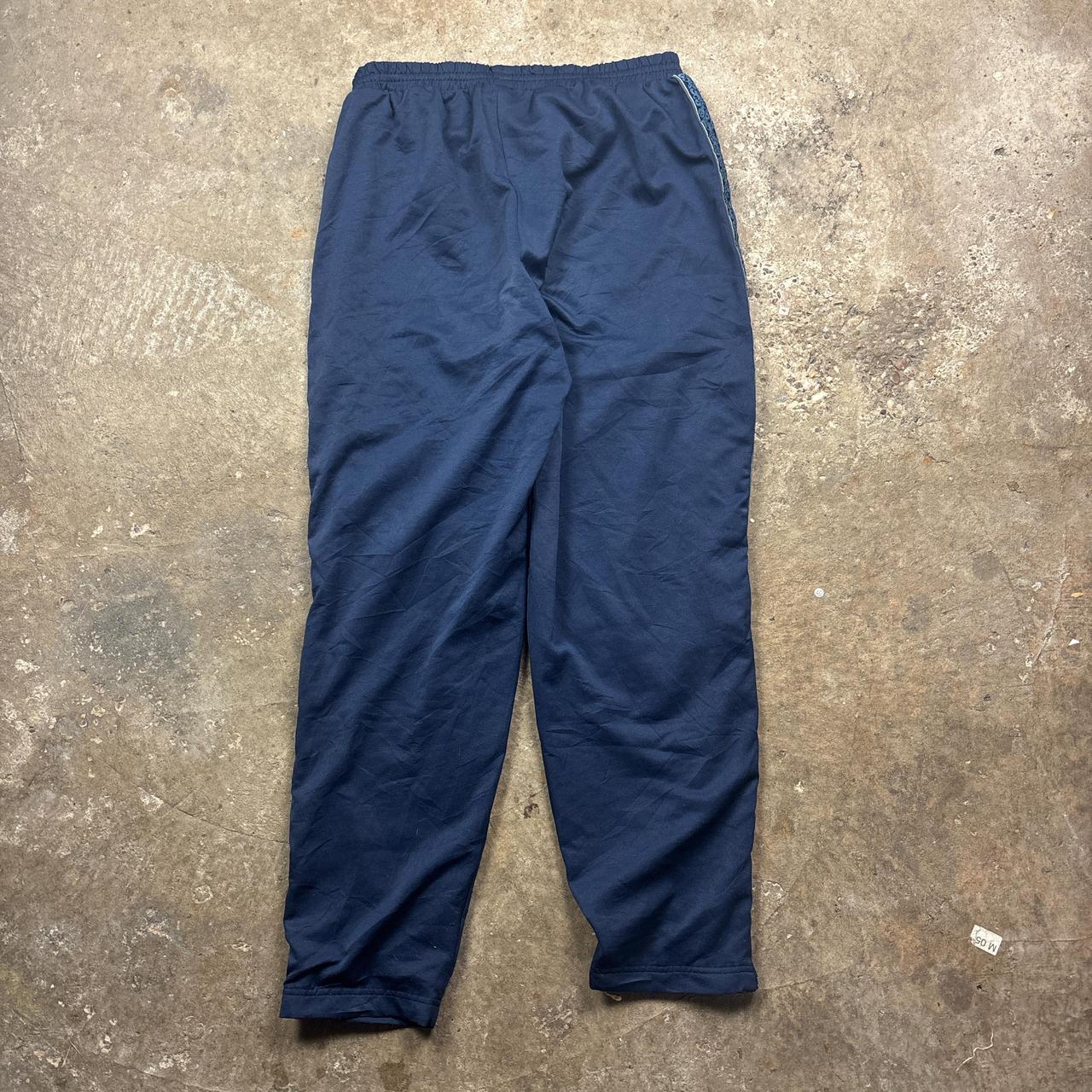 Vintage Blue Reebok track pants with embroidered logo and side stripe