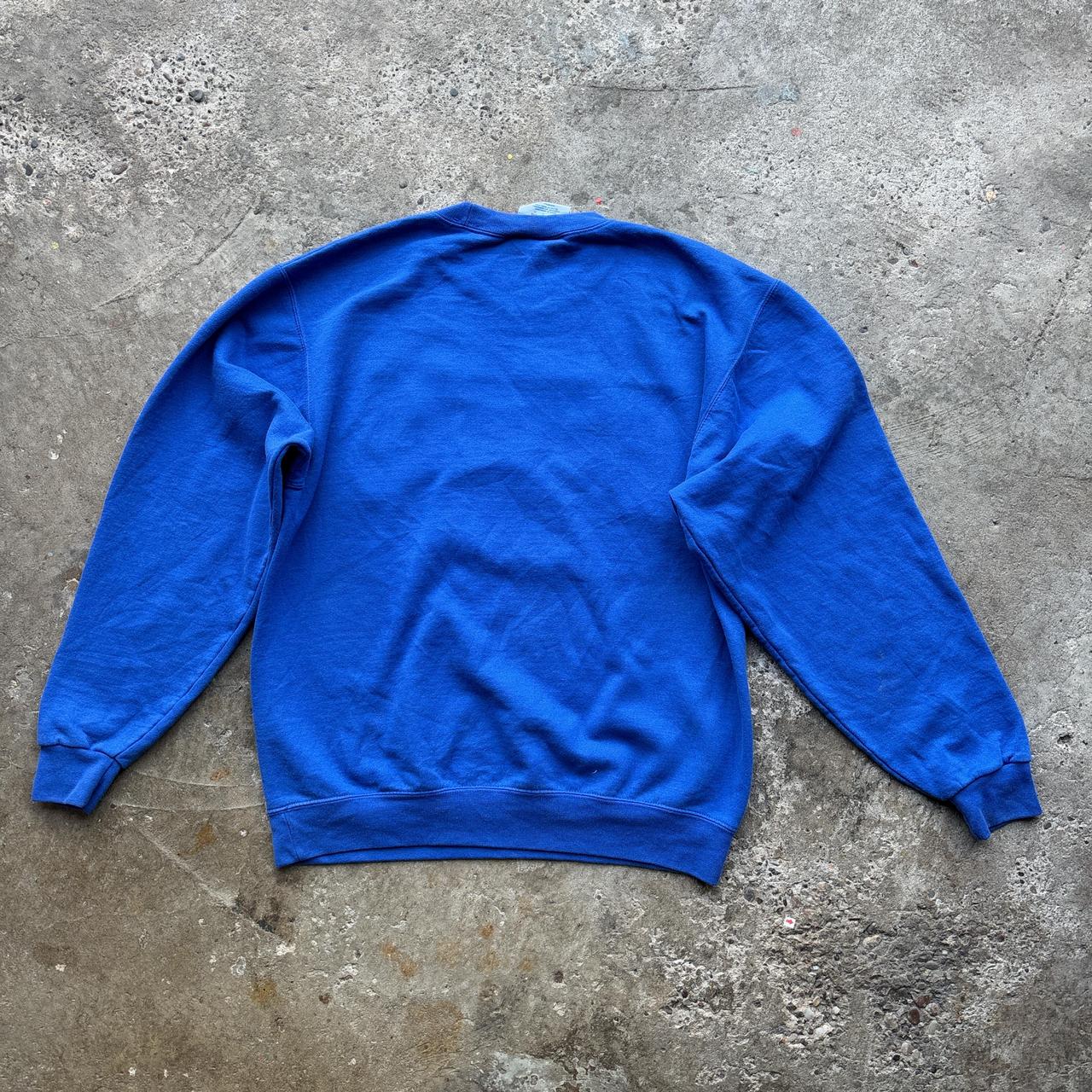 Blue Champion crewneck sweatshirt with Kansas University logo
