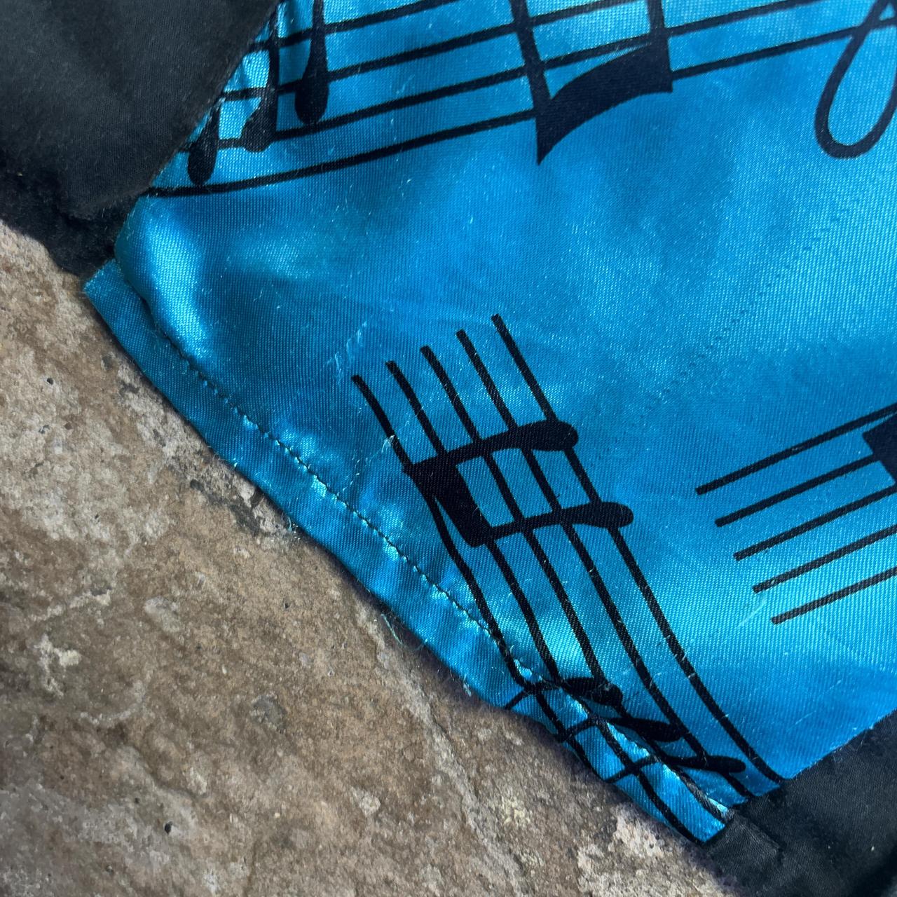 Blue and black musical notes bowling shirt