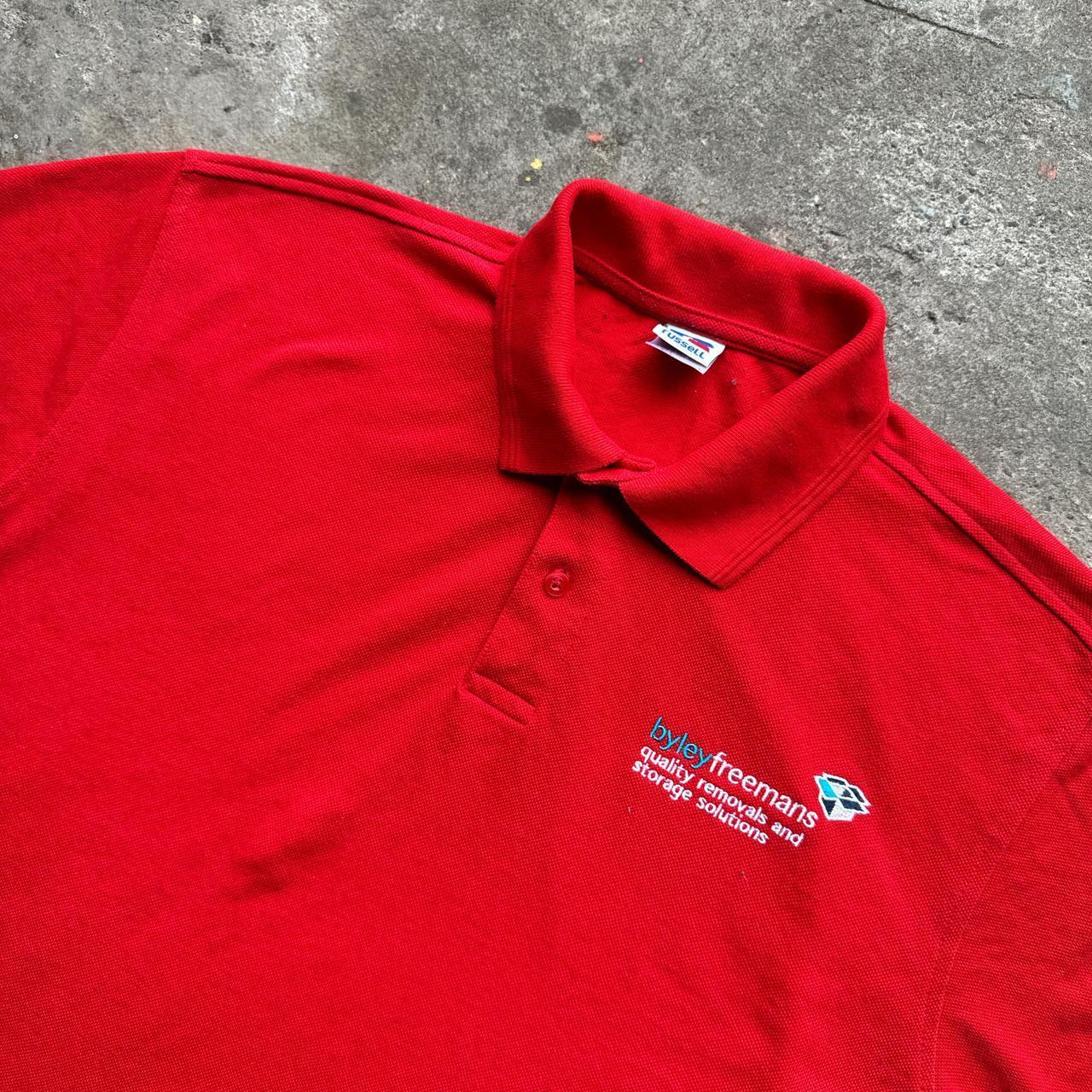 Red polo shirt with removal company embroidered design