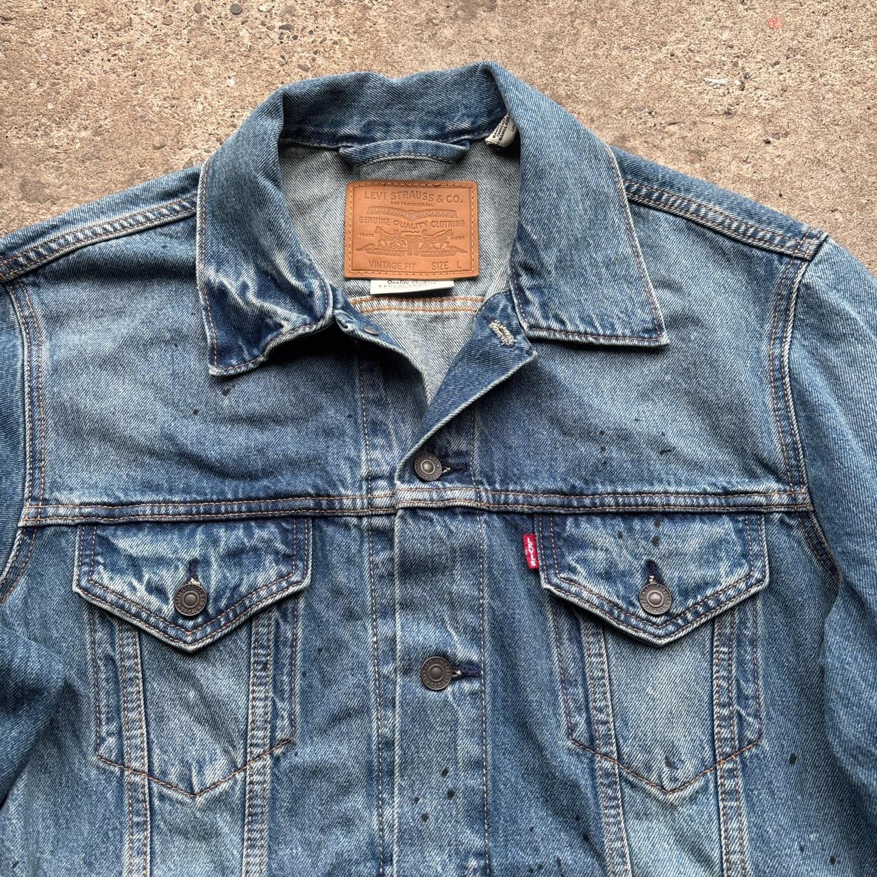 Blue Levi’s Trucker jacket with paint splats