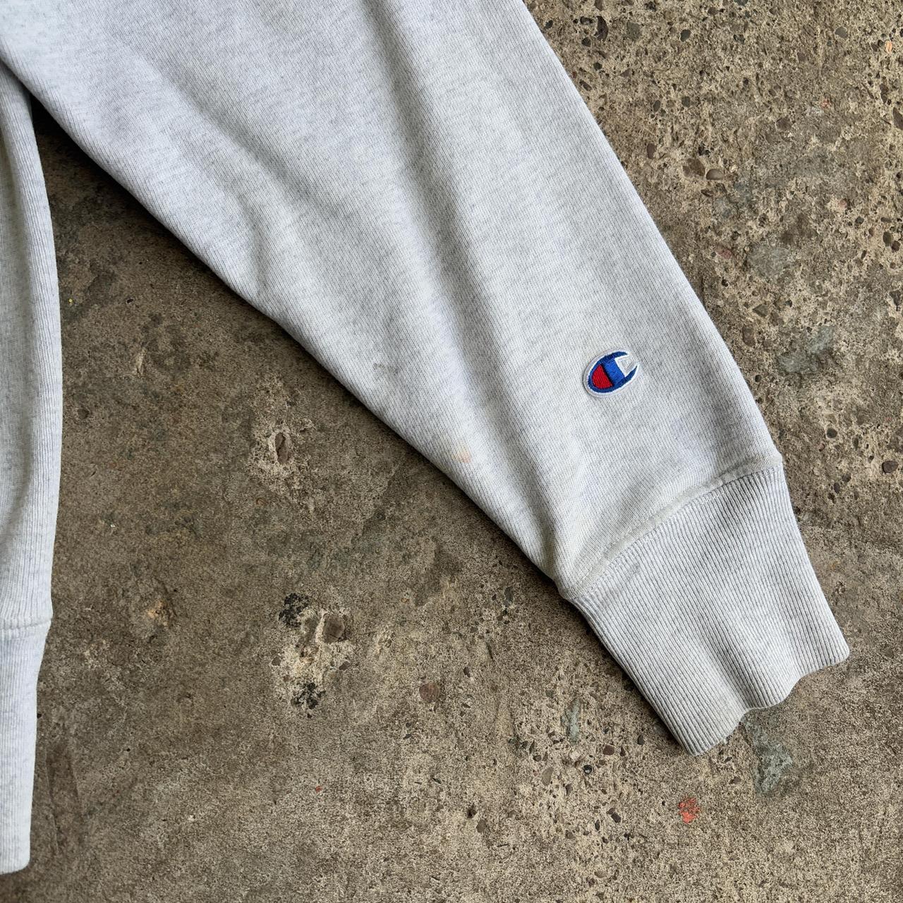 Champion grey crewneck sweatshirt with purple Northern Iowa University logo