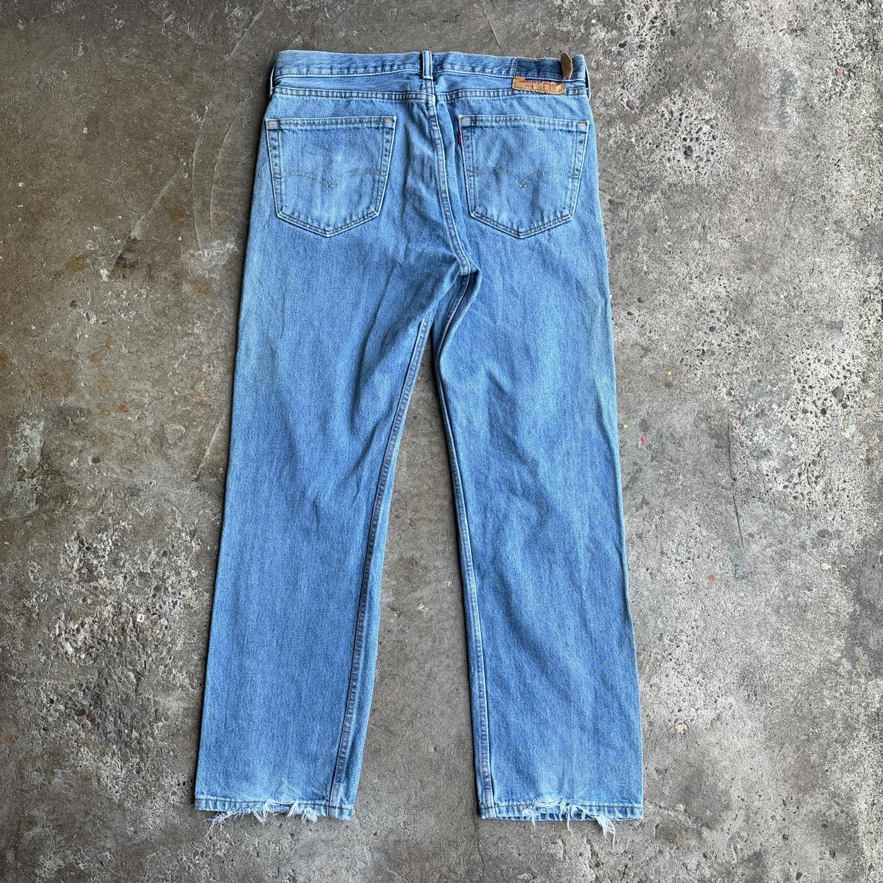 Levi's 505 distressed blue denim jeans