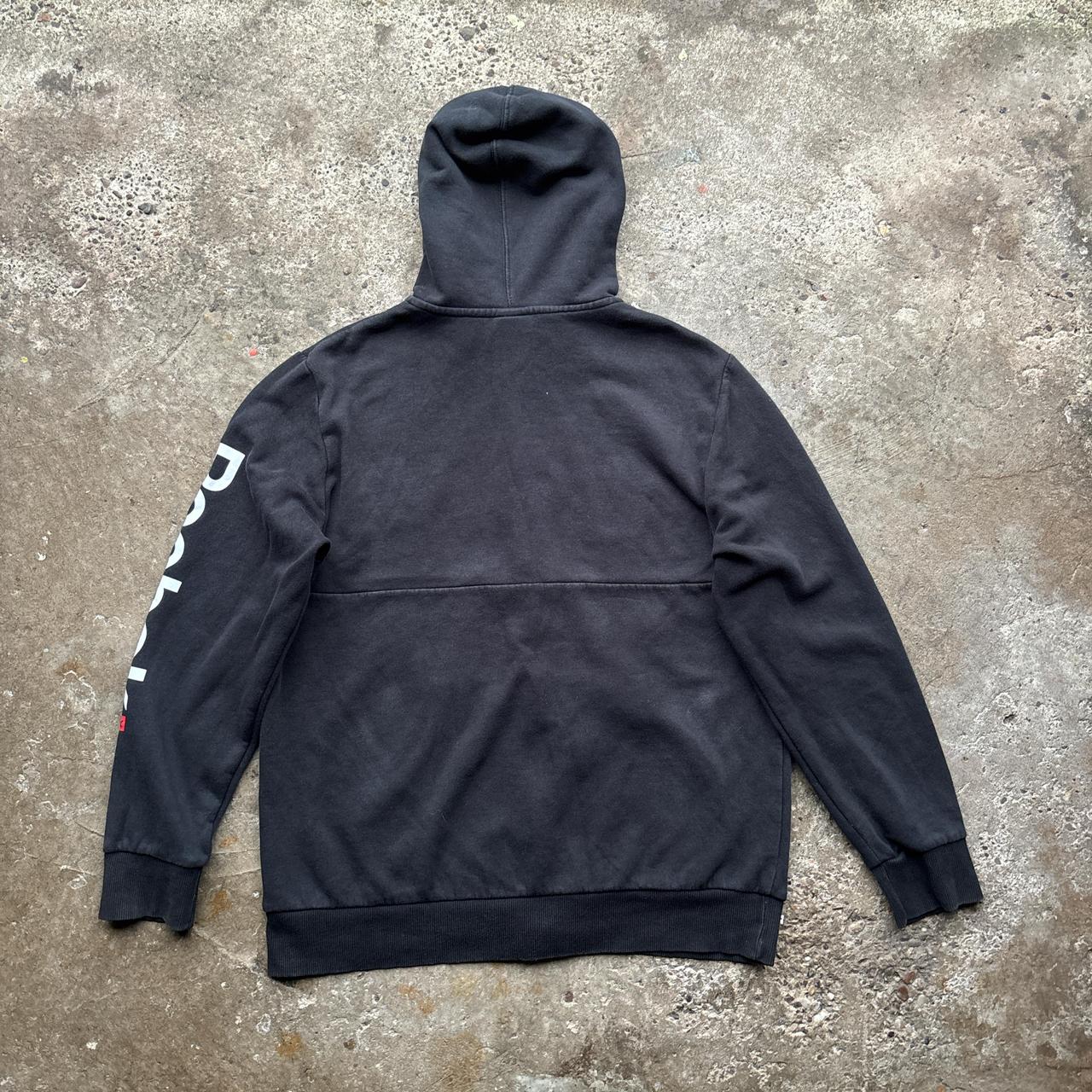 Black Reebok zip-up hoody with spell out logo