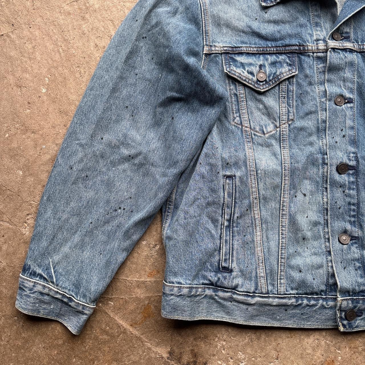 Blue Levi’s Trucker jacket with paint splats
