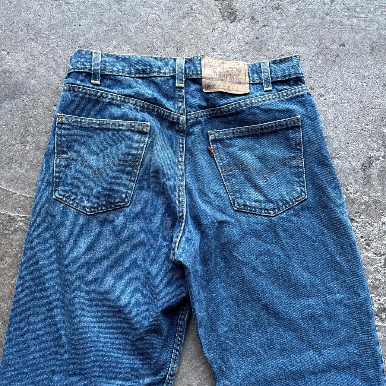 Levis 550 blue denim jeans with orange label