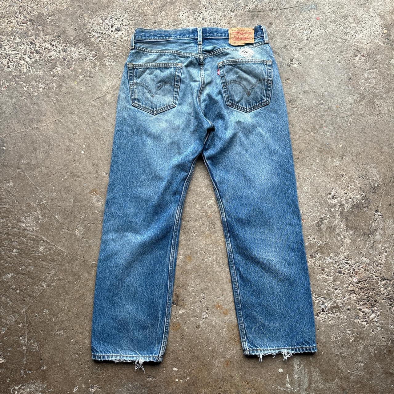 Blue Levi’s 501 distressed jeans - W34