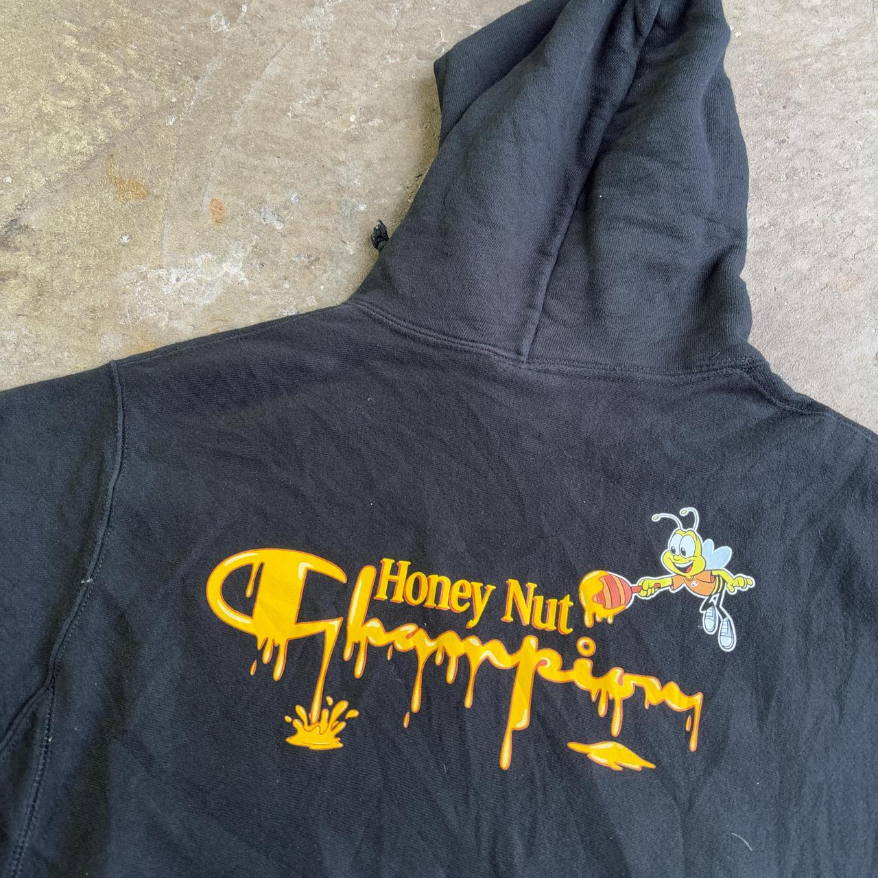 Black Champion hoodie with yellow Honey Nut design