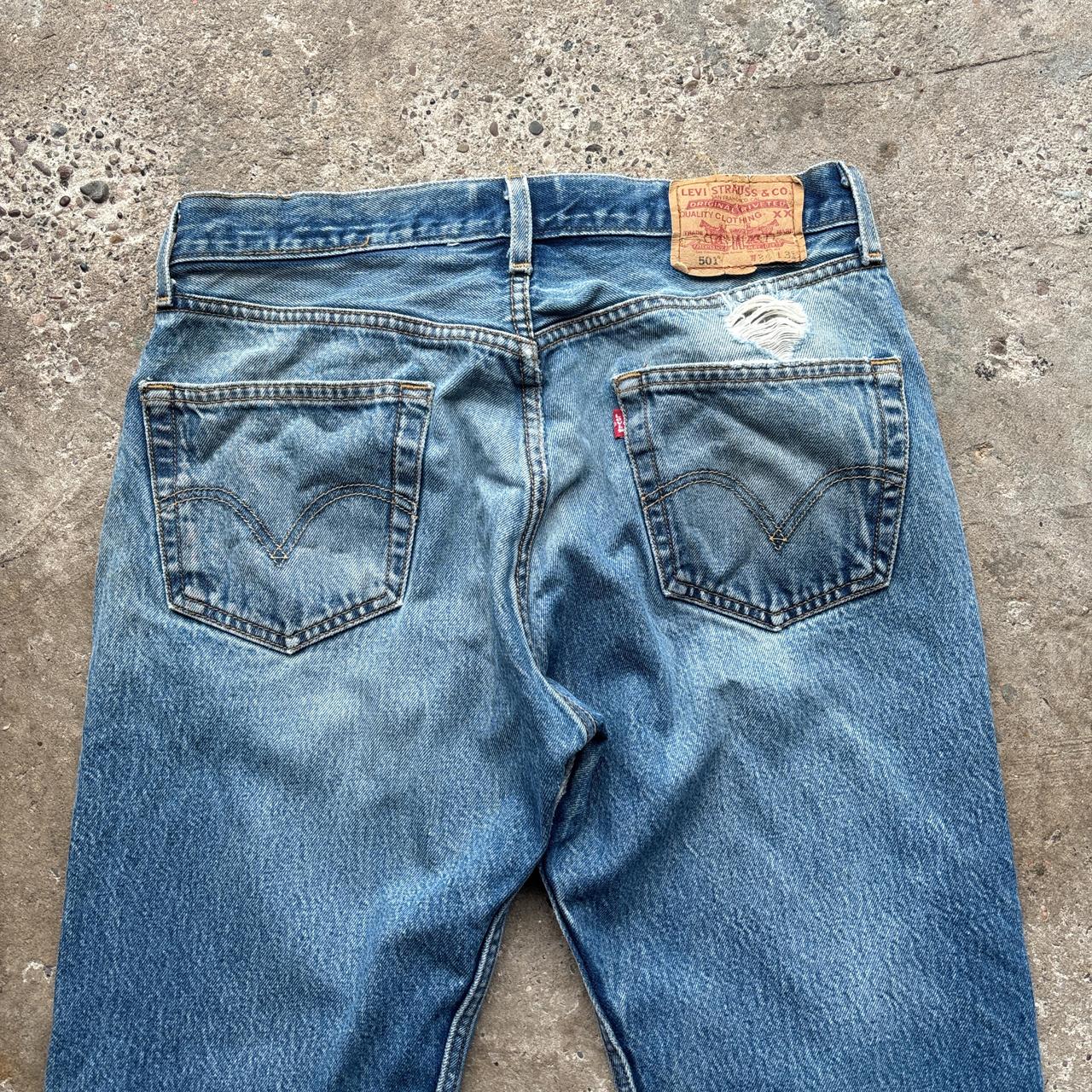 Blue Levi’s 501 distressed jeans - W34