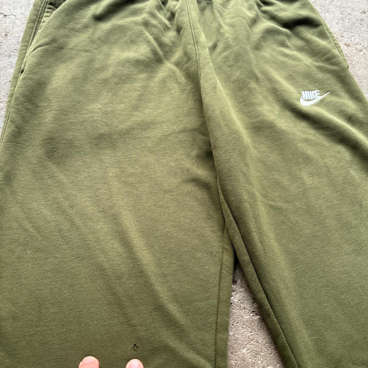 Nike green joggers with white embroidered logo