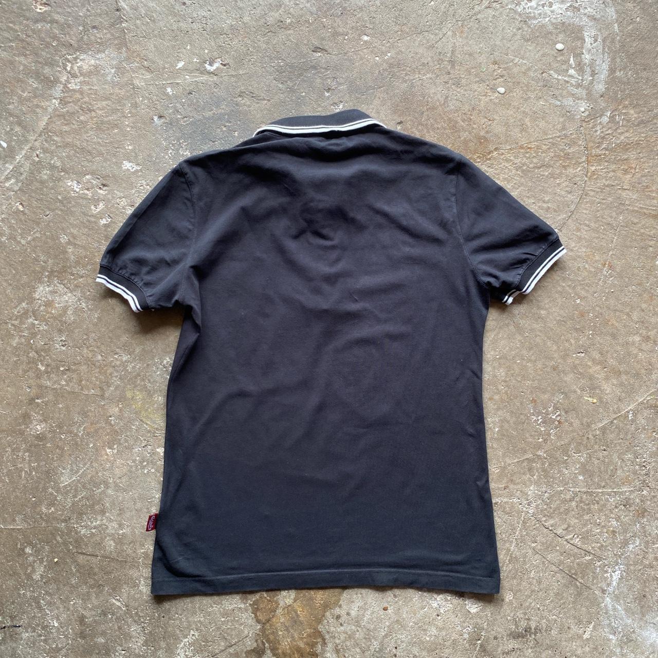 Black Carlsberg polo shirt with white tips