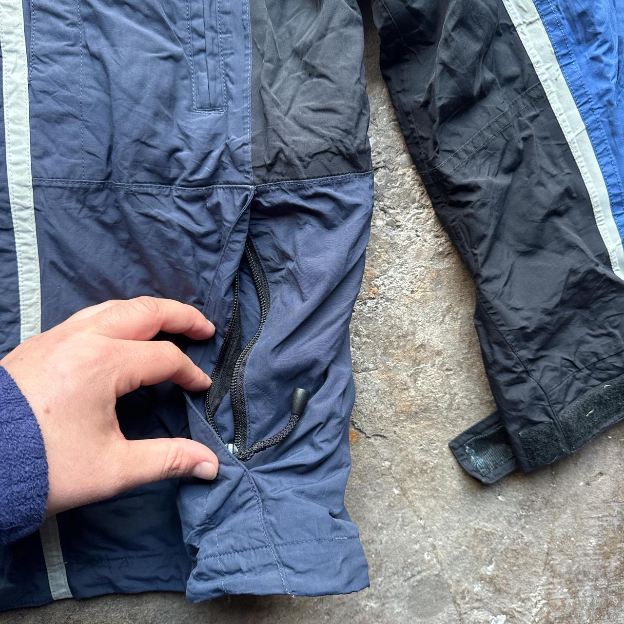 Navy, blue and black The North Face winter jacket