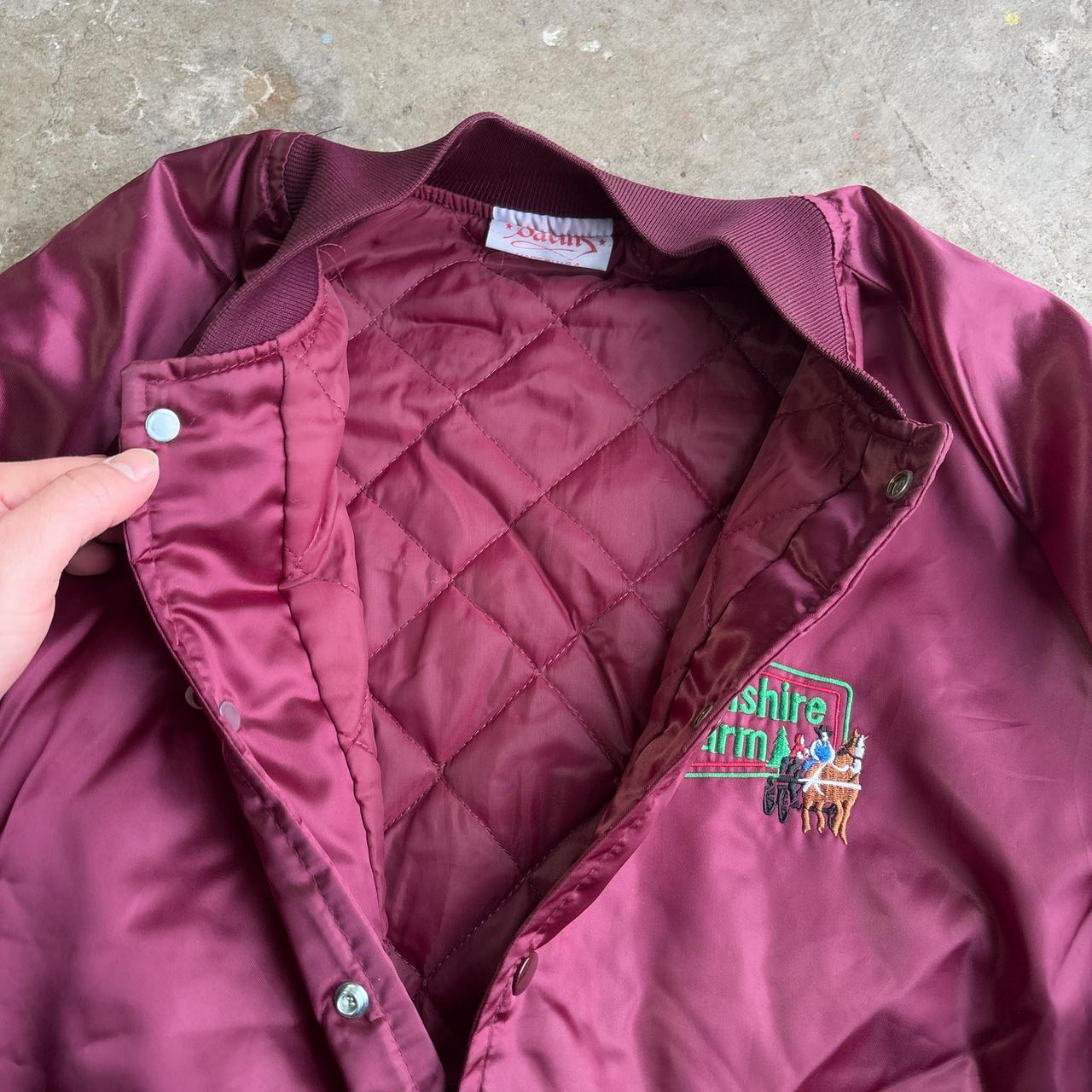 Jim’s Burgundy vintage bomber jacket with embroidered logo