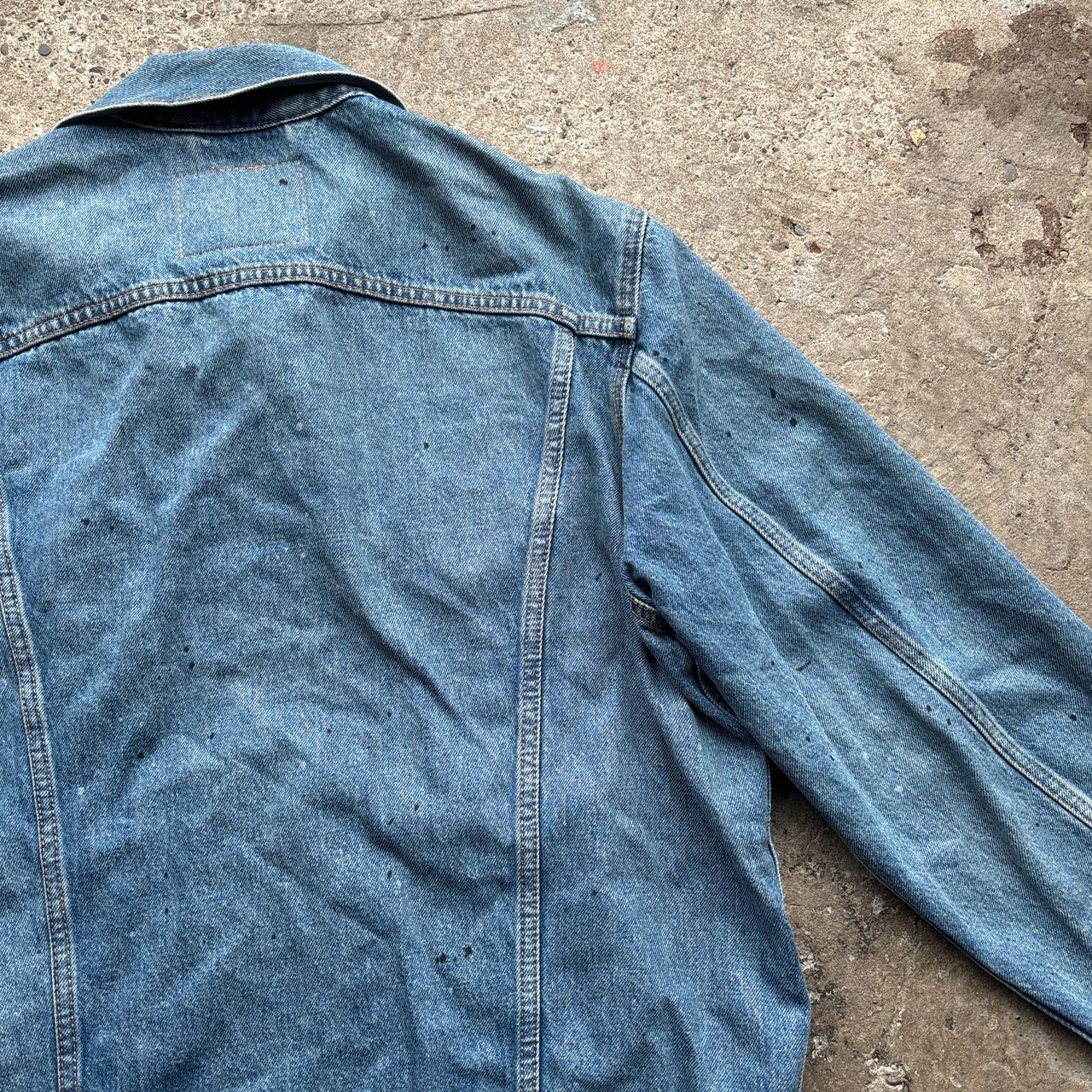 Blue Levi’s Trucker jacket with paint splats