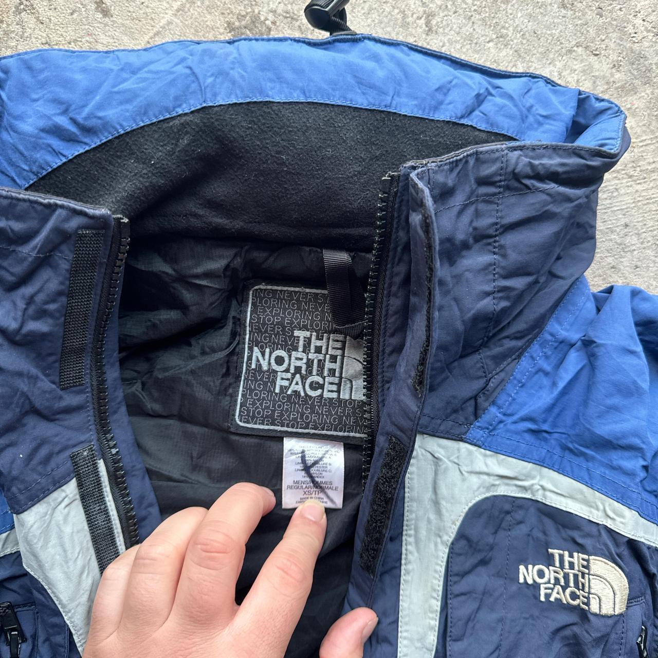 Navy, blue and black The North Face winter jacket