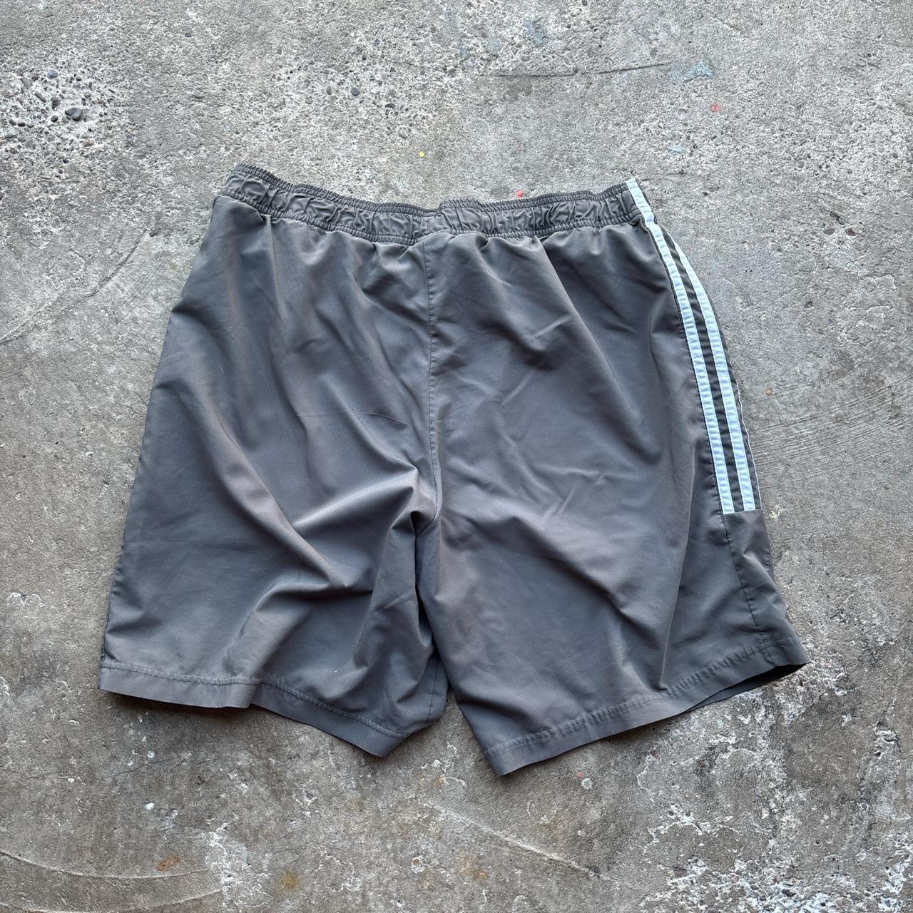 Grey Adidas active wear shorts with spell out logo