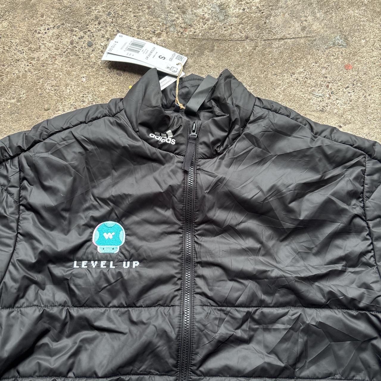 Black Adidas puffer jacket with Mario Kart embroidered logo
