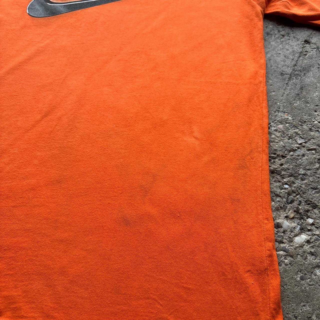 Orange Nike graphic tee