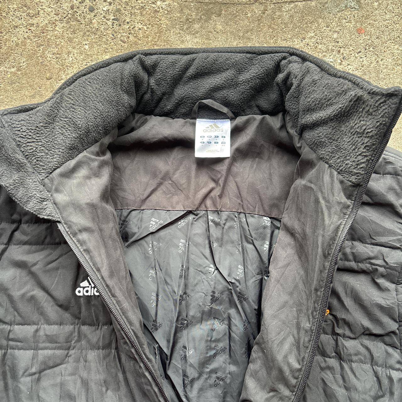 Black Adidas puffer jacket with embroidered logo