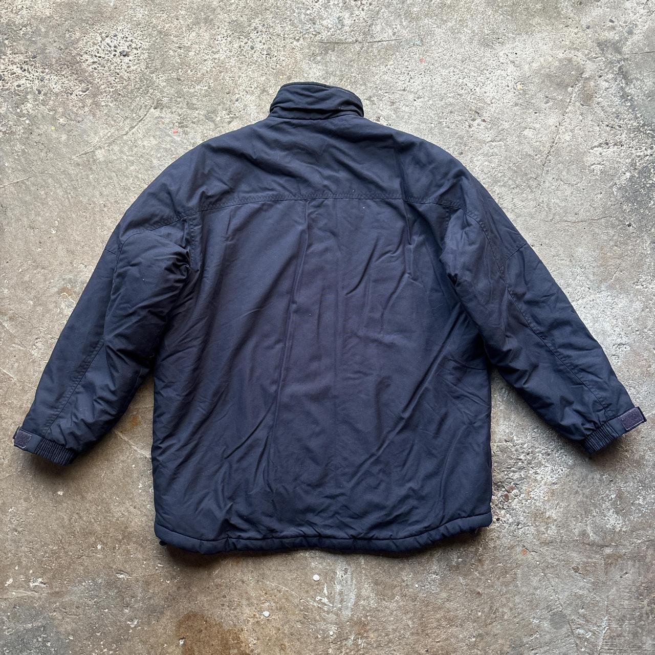 Navy and white Reebok puffer jacket