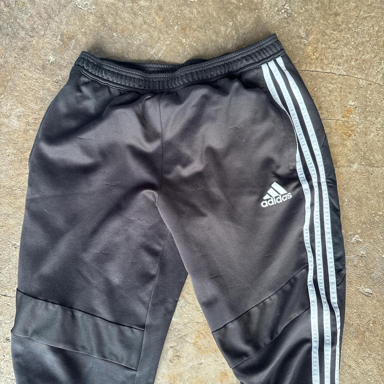 Black Adidas sweatpants with grey stripes and print logo