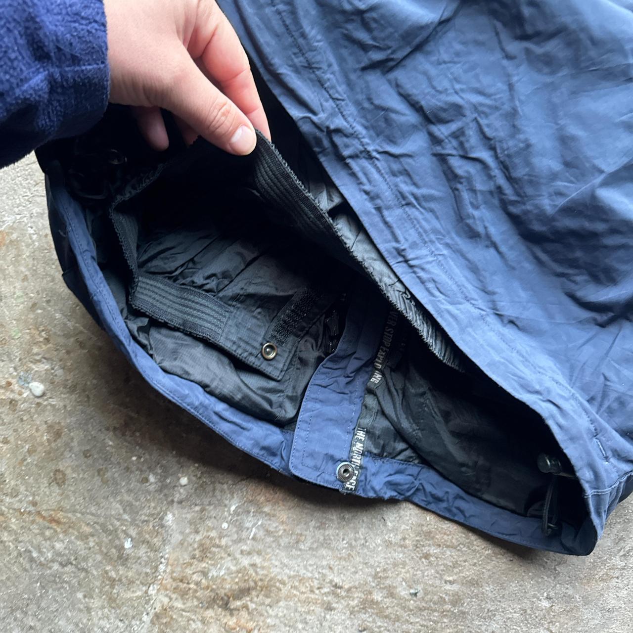 Navy, blue and black The North Face winter jacket
