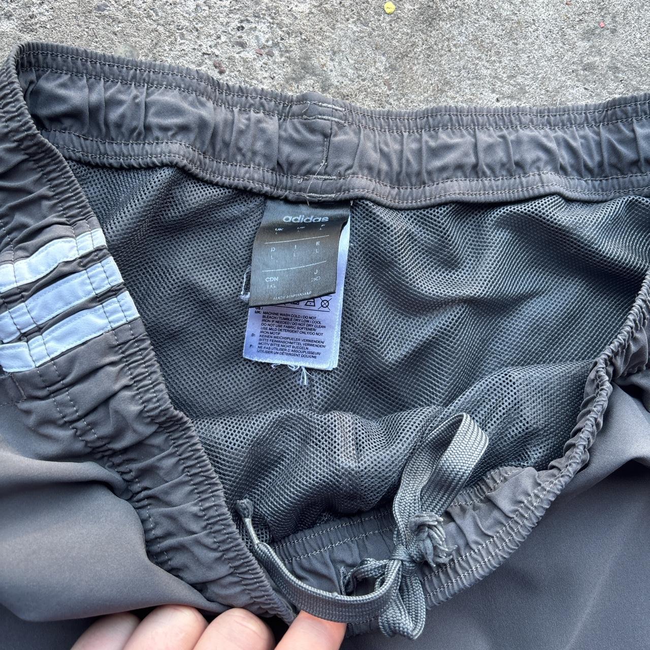 Grey Adidas active wear shorts with spell out logo