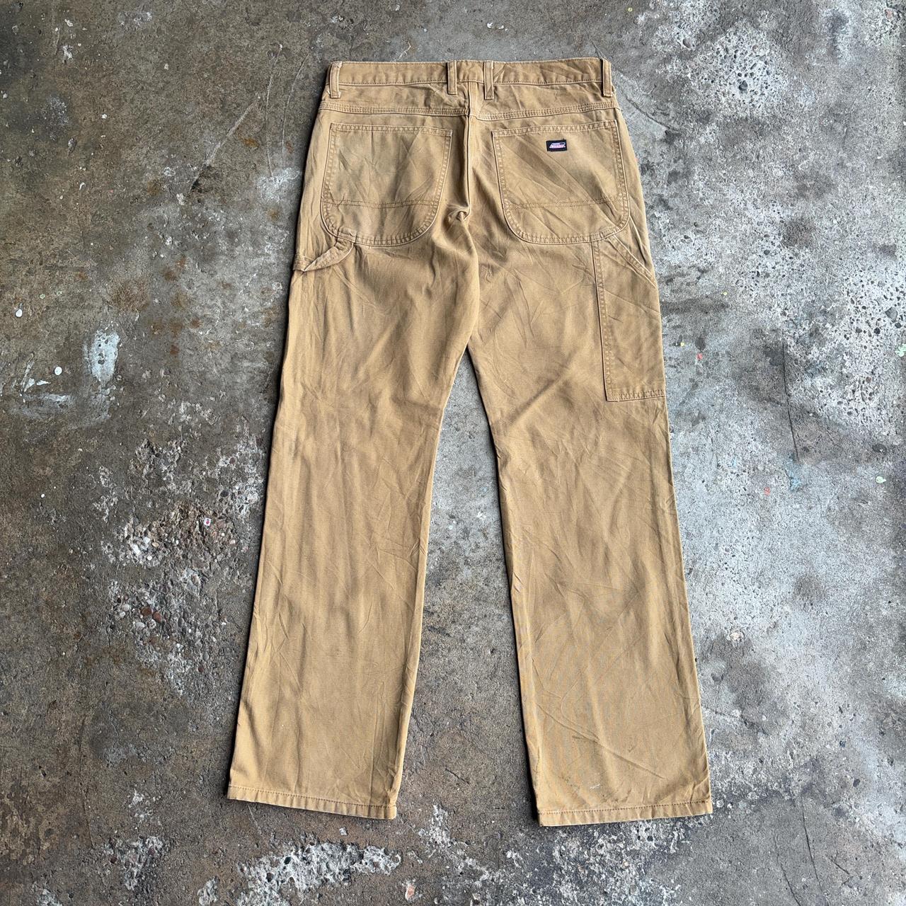 Tan Dickies straight leg carpenters pants with a relaxed fit
