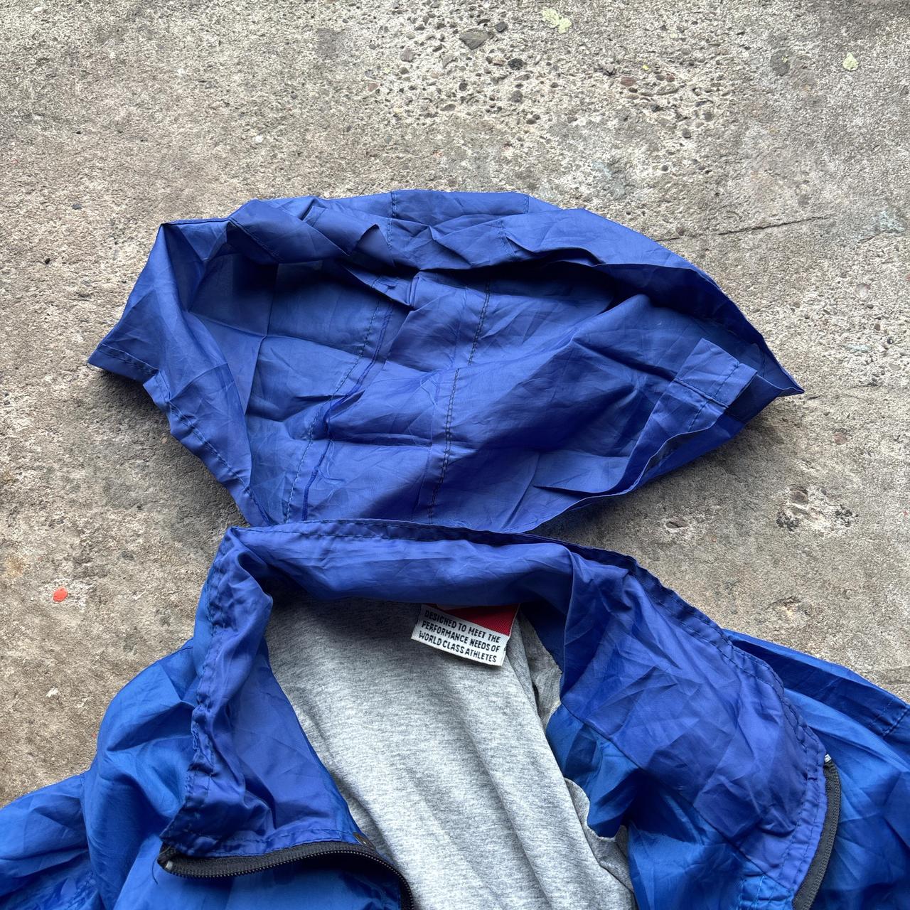 Blue Nike jacket with spell out logo