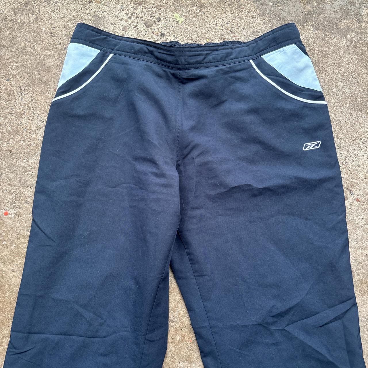 Navy blue Reebok sweatpants with embroidered logo