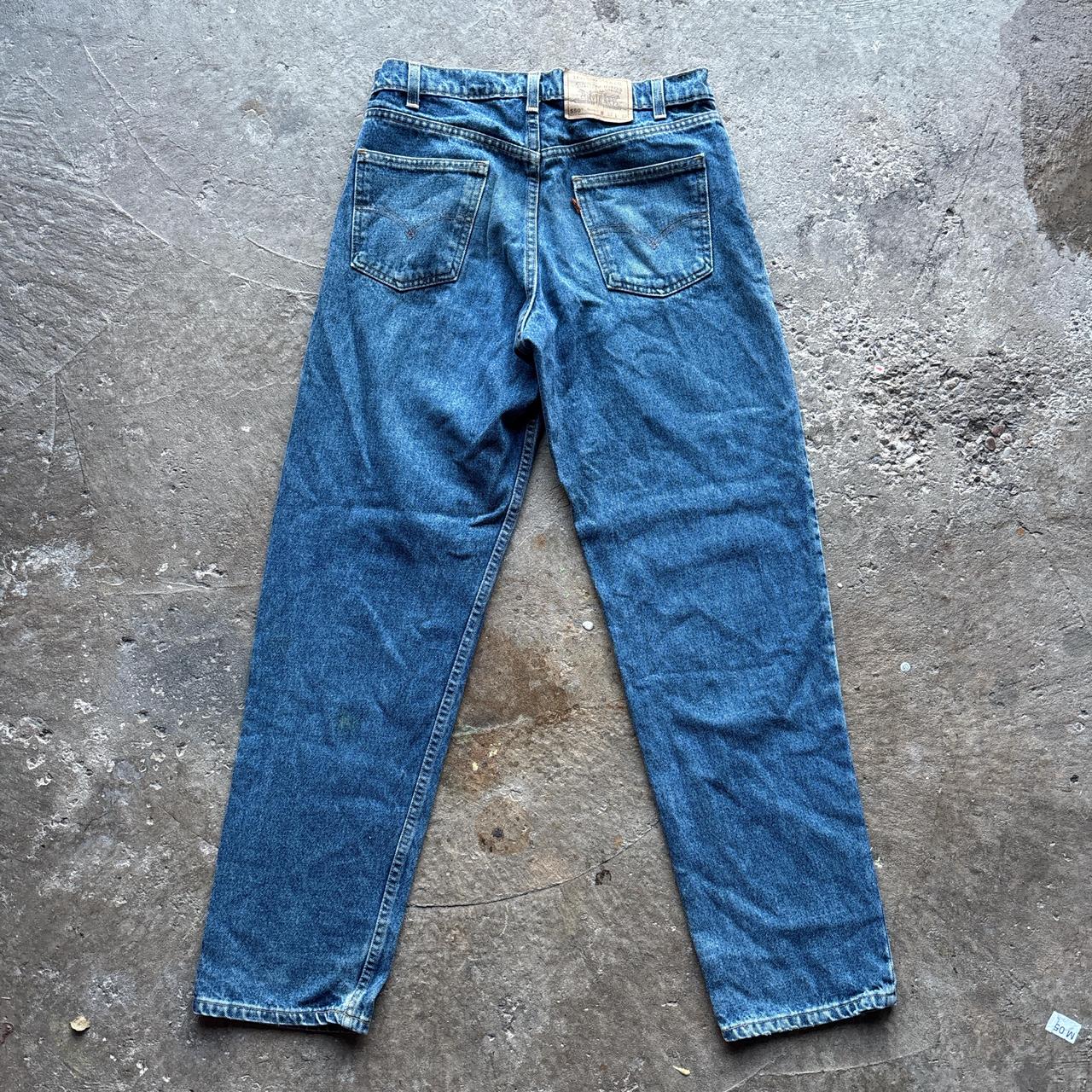 Levis 550 blue denim jeans with orange label
