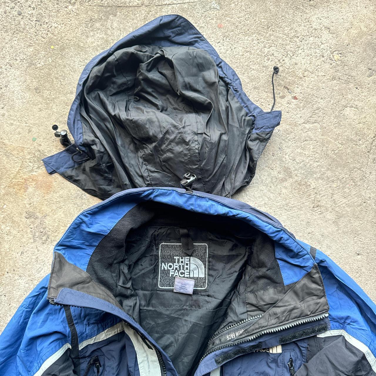 Navy, blue and black The North Face winter jacket