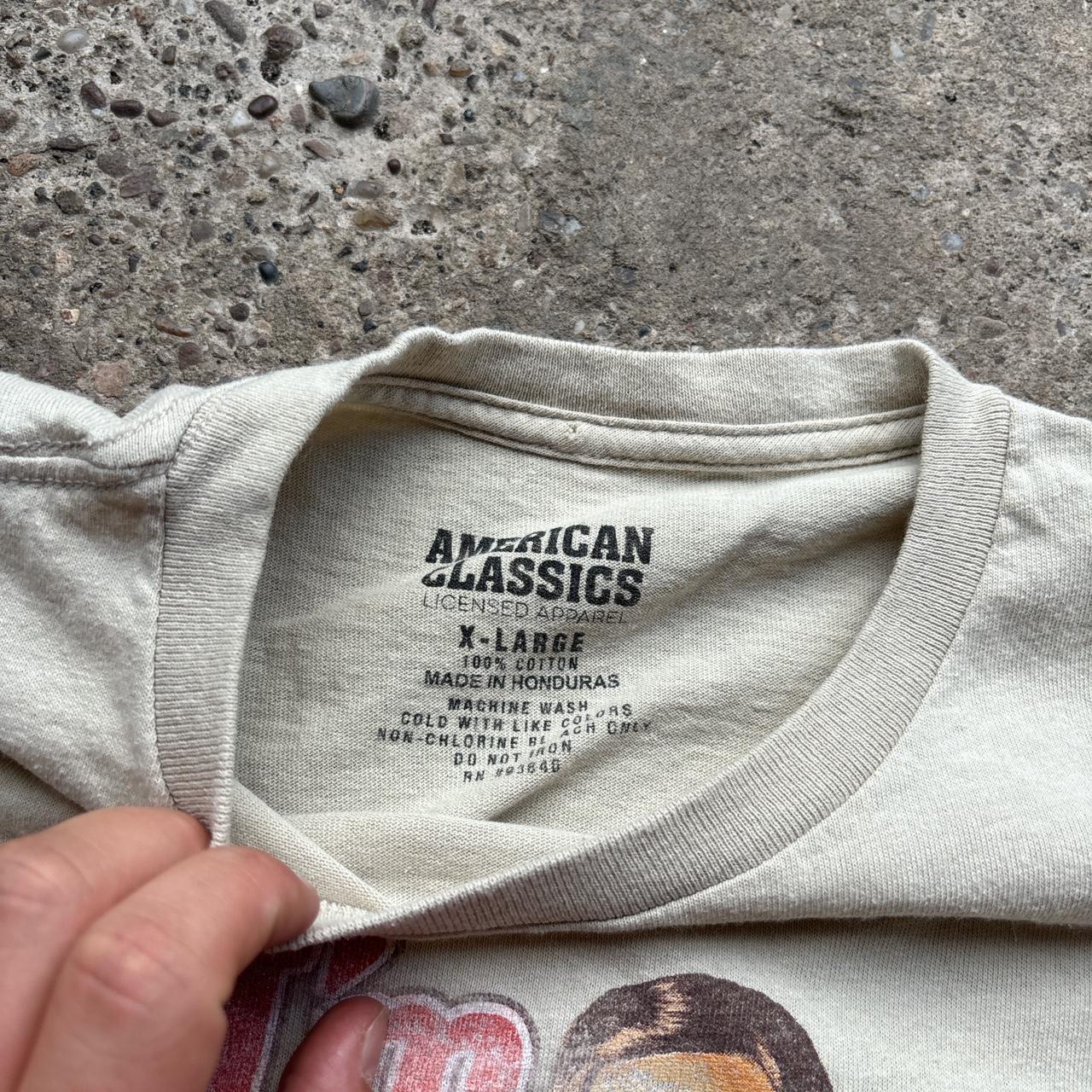 Cream Anchorman promotional tee
