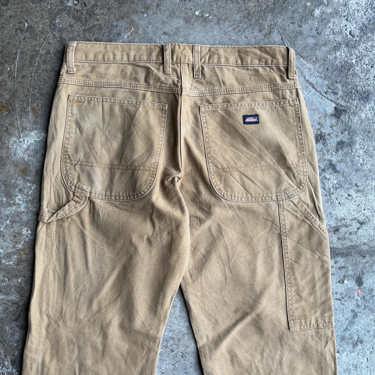 Tan Dickies straight leg carpenters pants with a relaxed fit