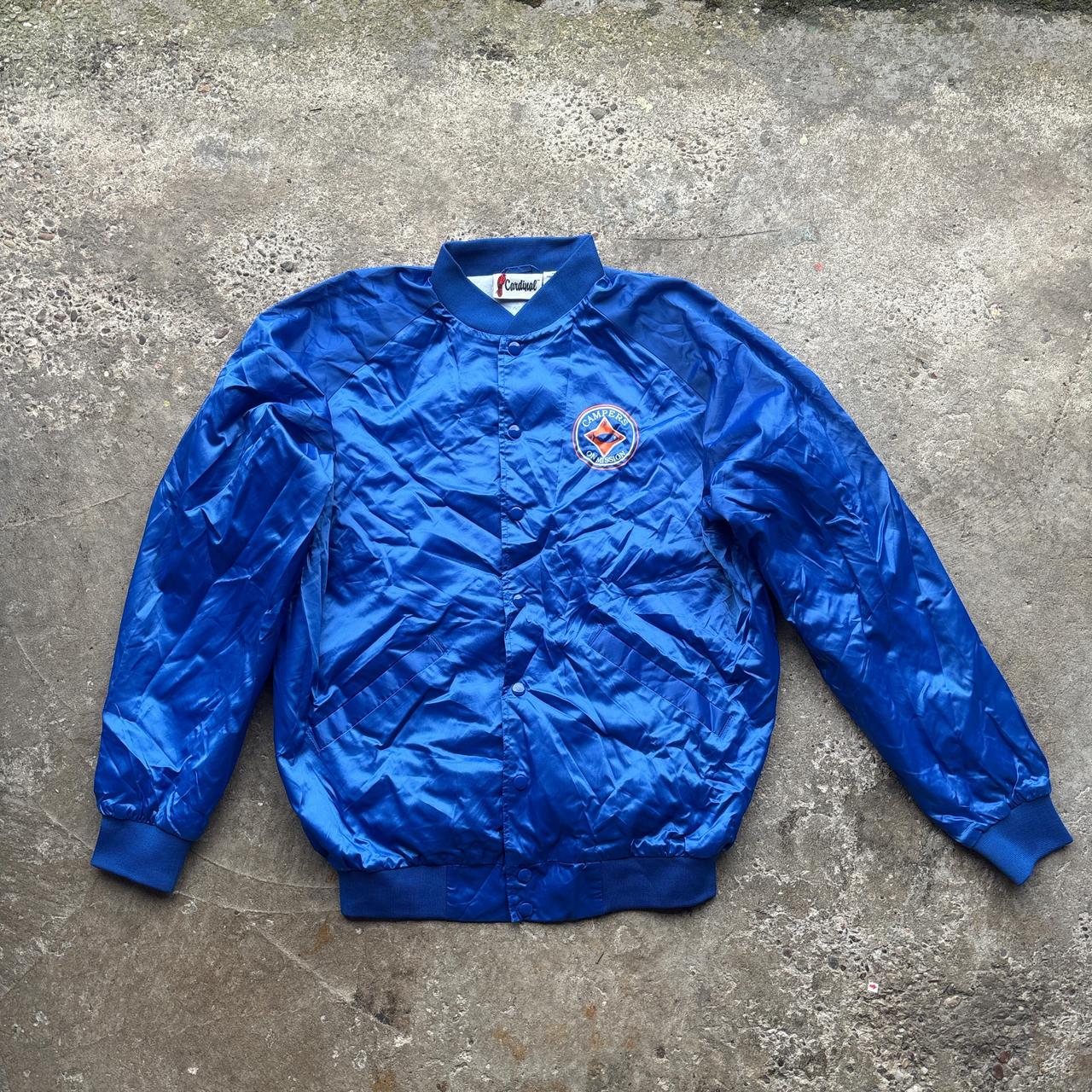 Blue Cardinal bomber jacket with ‘Campers on Mission’ logo