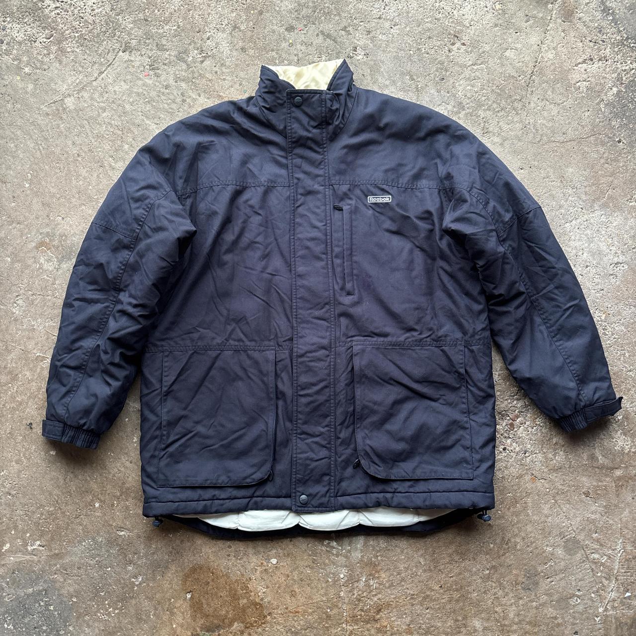 Navy and white Reebok puffer jacket