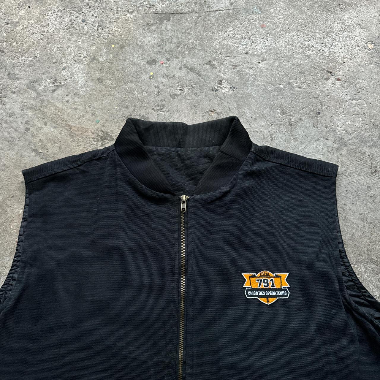 Black workwear body warmer with soft quilted lining and embroidered logo