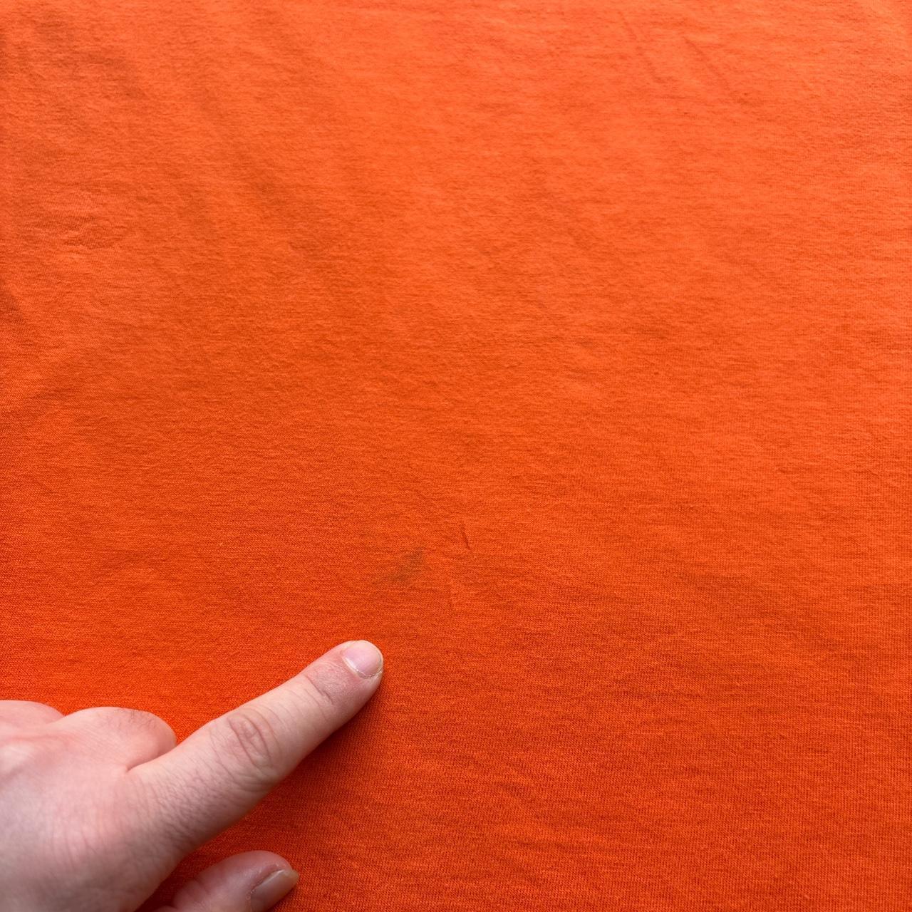 Orange Nike graphic tee