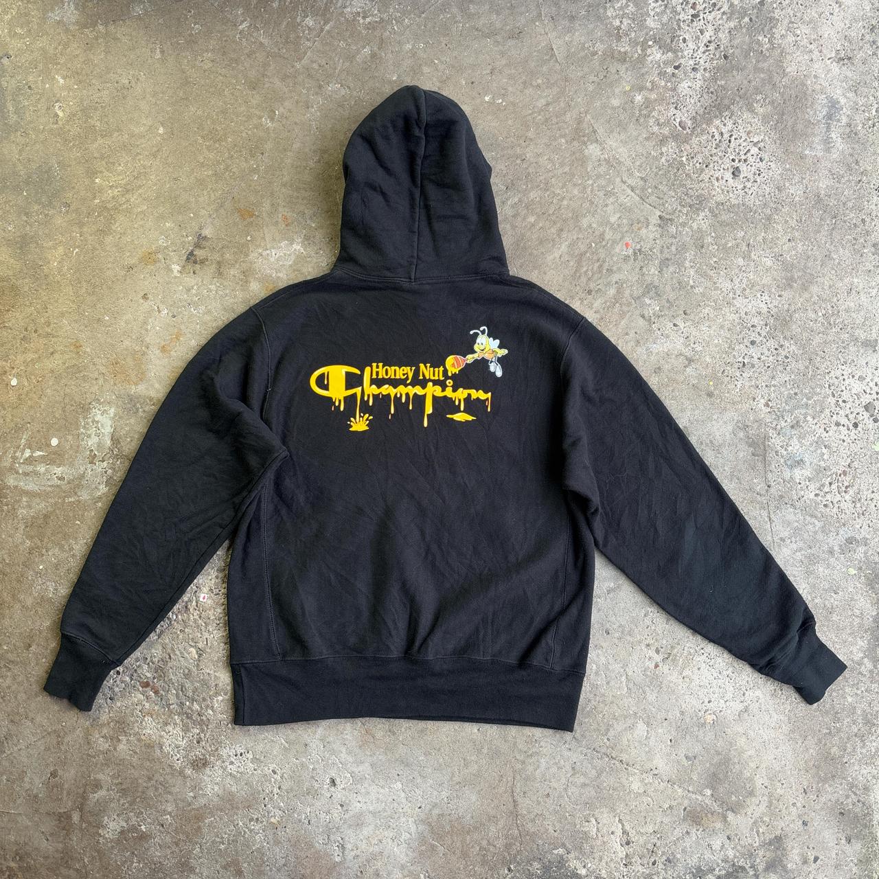 Black Champion hoodie with yellow Honey Nut design
