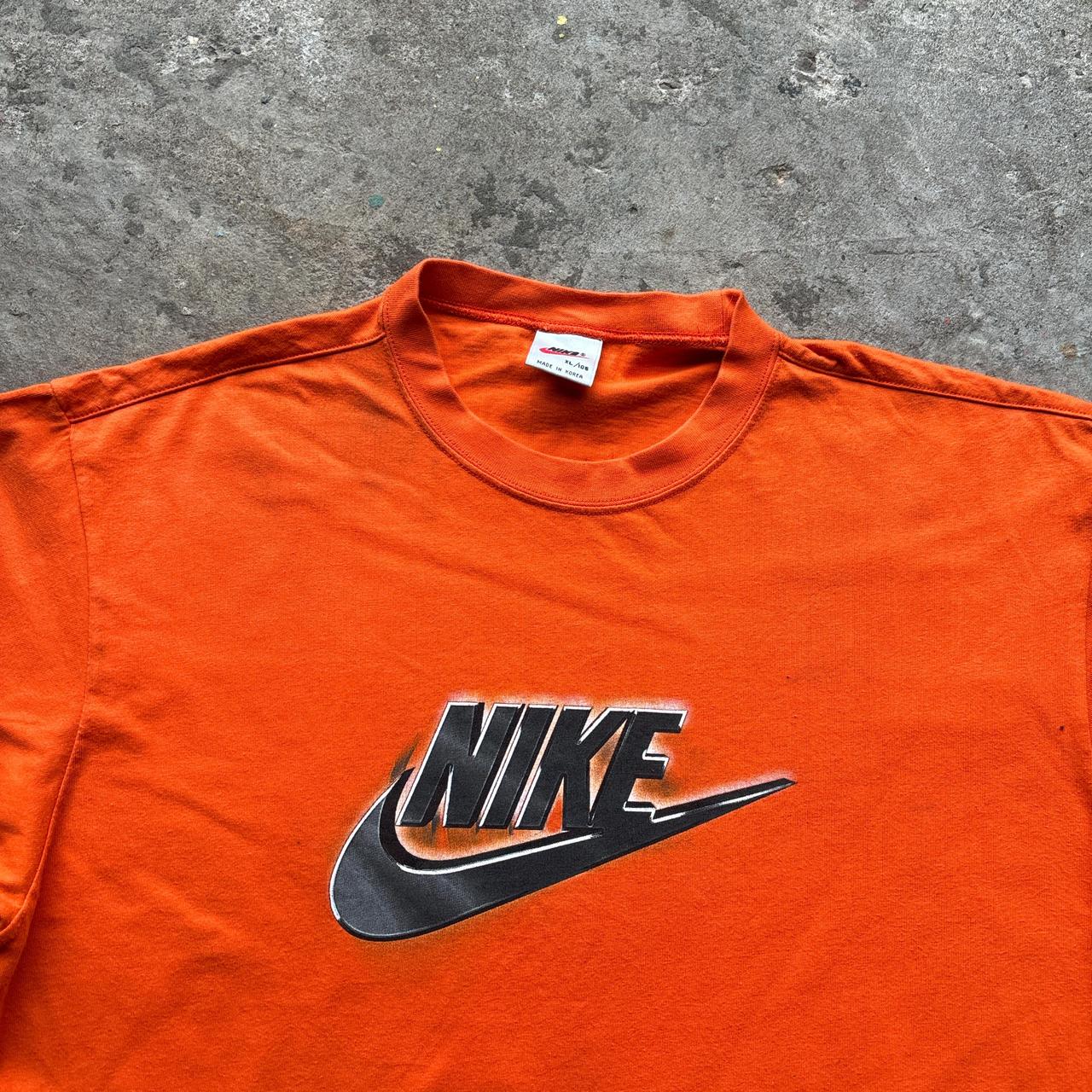 Orange Nike graphic tee
