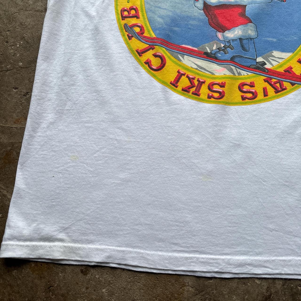 White graphic tee with ‘Santa Ski Club’ graphic