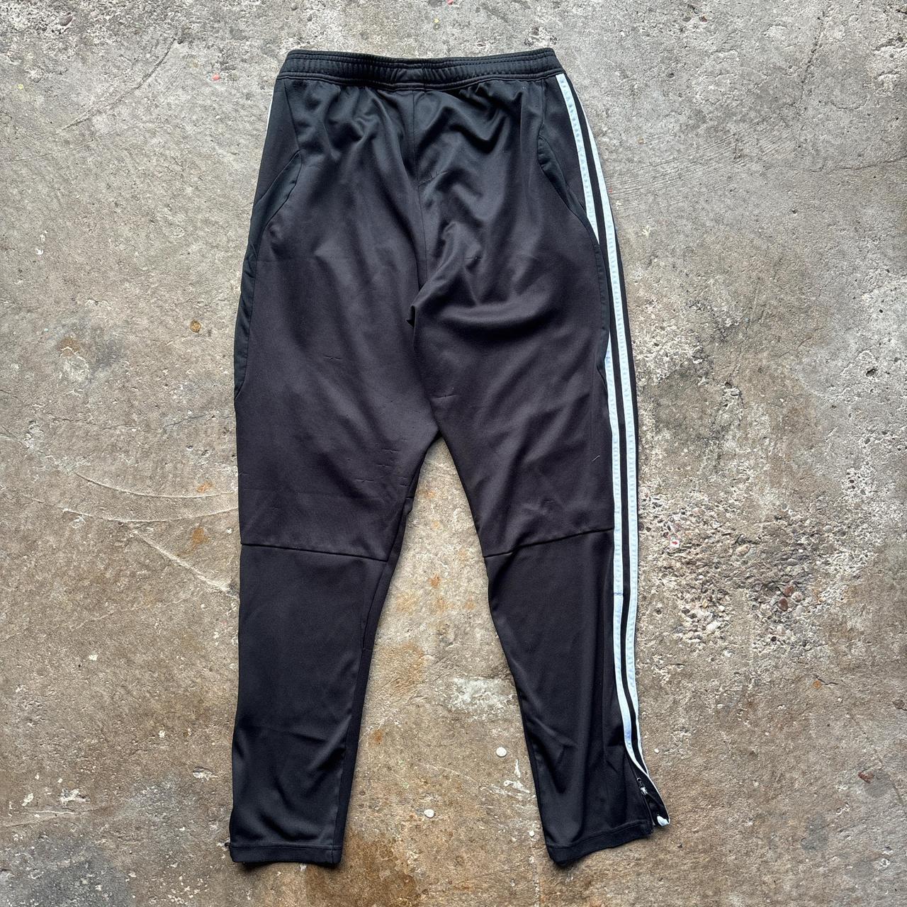 Black Adidas sweatpants with grey stripes and print logo