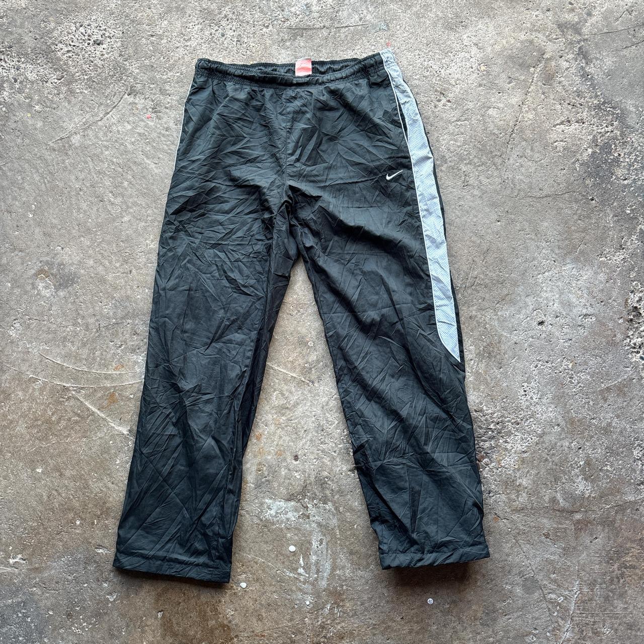 Black 00s Nike track pants with grey side stripe