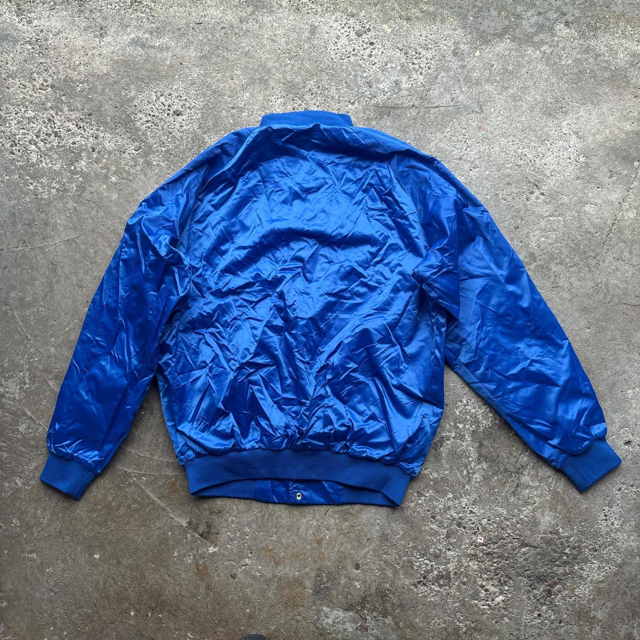 Blue Cardinal bomber jacket with ‘Campers on Mission’ logo